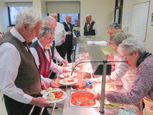 Rotarians preparing to serve the meals