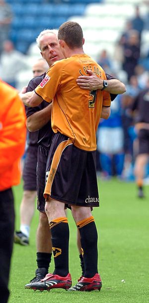 Manager Mick McCarthy celebrates with Neill Collins.