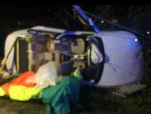 Supporting image for story: Driver rescued after car crashes onto its side