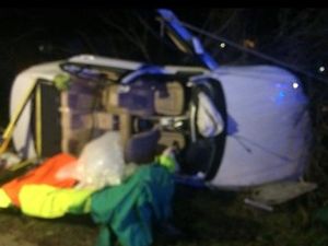 Supporting image for story: Driver rescued after car crashes onto its side