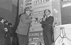 March 4, 1966. The opening night of the Star Bingo and Social Club, at the Clifton, in Bilston Street, Wolverhampton, presentations were made before the first game. Here Mr Hubert Stone is being presented with a life membership ticket for being the oldest man present. He was 77. Making the presentation is Mr G Batty, area manager.