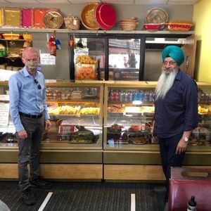 Pat McFadden with Lakshmi sweet centre founder Major Singh Jawanda 