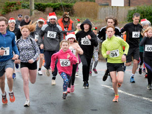 Supporting image for story: Santa returns from his holiday to take part in postponed fun run