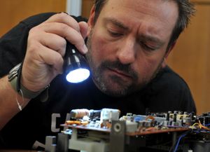 Rob Wix fixing a radio 