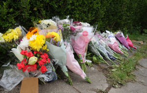 Tributes left at the scene of a fatal house fire
