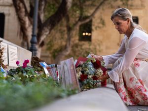 Supporting image for story: Sophie meets murdered journalist’s family and lays flowers in her memory