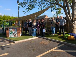 Staff from Homes Plus and SYA with members of the youth forum opening the garden.