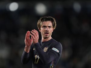 Jack Grealish applauds fans after England's match with Finland