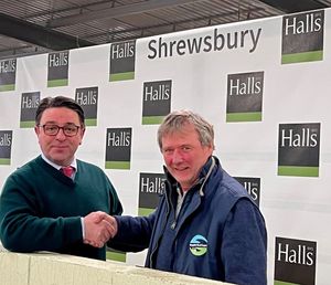 Andrew Bebb (right) thanks Halls director James Evans for the company’s pledge to match fund money raised for the community access defibrillator at Shrewsbury Auction Centre.