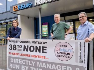 Campaigners celebrate victory -- with a banner that they never needed to use!