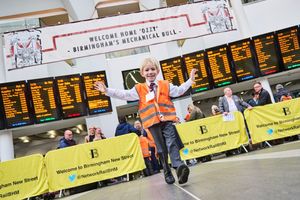 Ben celebrates at Birmingham New Street after being given his uniform