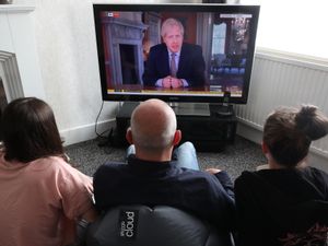 People in a house in Liverpool watch Prime Minister Boris Johnson address the nation about coronavirus on May 10 2020