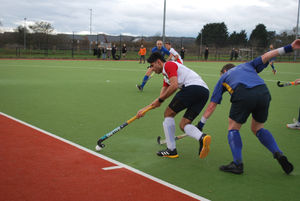 An outstretched Stourport Defender dives to stop Harborne