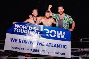 The trio celebrate their achievement.