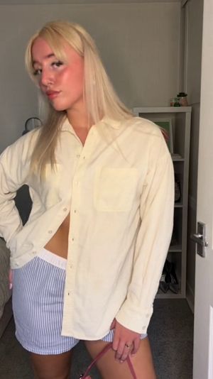 Abbie Fidgett, 22, styling boxer shorts as part of her outfits. See SWNS story SWNJouterwear. A woman wears underwear as "outerwear" to overcome her body dysmorphia - and dons lingerie, corsets and boxers to go to the beach and on nights out. Abbie Fidgett, 22, began suffering from body dysmorphia after she was bullied throughout school and college. She spent 20 weeks on a waiting list for cognitive behavioural therapy (CBT) and refused to go back to the GP after they wanted to weigh her. She wrapped up in winter coats all year round to hide her body but in November 2020 decided to ditch it for underwear instead - after trying exposure therapy wearing different outfits.