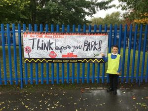 Cameron, also aged 10 with his poster - "If you care about children, think before you park."