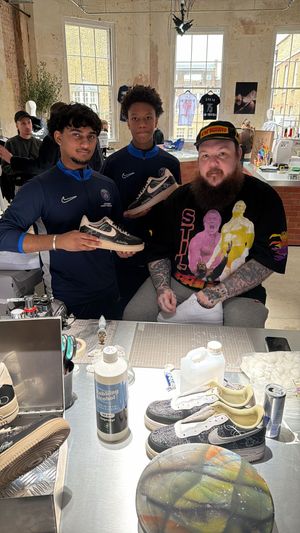 Admiring the artwork of London Sneaker School