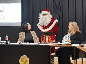 Santa wishes Councillor Eileen Callear., left, (Telford mayor and chair of Hadley & Leegomery Parish Council) and council clerk Jane Lees, right, Merry Christmas. Picture: LDRS
