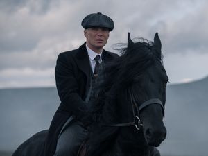 Cillian Murphy riding a horse as Tommy Shelby in Peaky Blinders