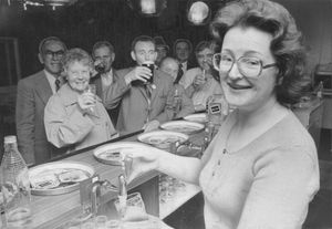 Betty Bradley serves up some good cheer for thirsty members of Darlaston Ex-Servicemen's Club in 1975