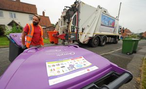 Collecting waste at Marlbrook Way, Telford, and putting stickers on the purple top bins
