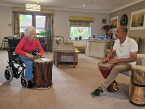 Supporting image for story: Care home residents discover their rhythm with African drumming workshop