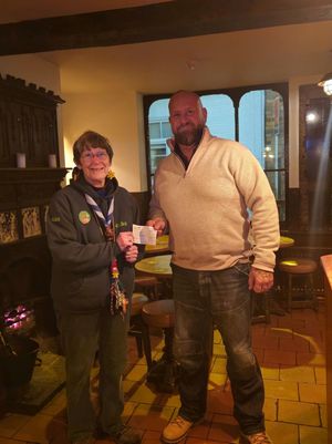 Chairman James Gittins hands cheque to Alice Pritchard from 8th Bridgnorth Scouts 