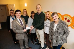 A cheque is handed over to Action For Children in Shrewsbury, presented by Deputy Mayor Alex Wagner.