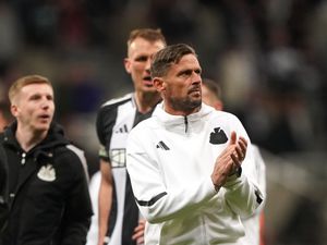Newcastle's assistant head coach Jason Tindall applauds the fans following the 5-0 win over Crystal Palace