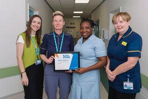 Nurse Tamika Roberts (centre right) receiving her RJAH Stars Award from Stacey Keegan, Chief Executive (centre left) and Olivia Evans (left), and Anne Worrall (right).