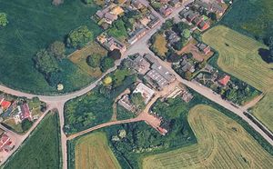 The plans could see to build up to nine homes be built on a patch of land next to a farm in Ightfield, near Whitchurch. Photo: Google