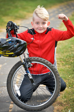 Nine-year-old Dylan Atkinson has raised almost £700 for the Queen Elizabeth Hospital in Birmingham.
