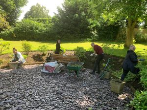 Supporting image for story: Staff from Wolverhampton law firm spruce up gardens at Compton Care's Compton Hall