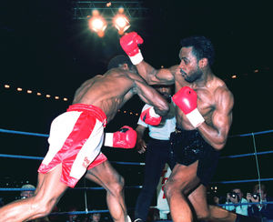 Nigel Benn and Chris Eubank throwing punches