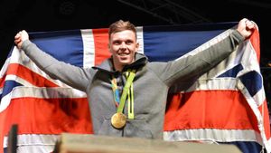 Olympic Gold medallist Joe Clarke enters the stage