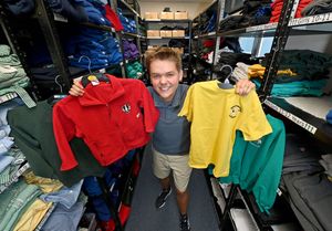 Cameron Anderson from Telford Crisis Support, with some of the uniforms on offer for struggling families. Photo: Tim Thursfield