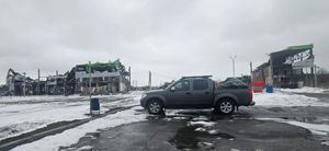 Aid truck parked in bomb damaged area Kyiv