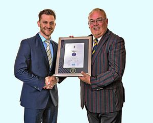 Bob Williams collects the Newport CC Clubmark. Pictures by Kidz In Sport.