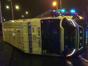 Supporting image for story: Ambulance on 999 call ends up on side outside Merry Hill