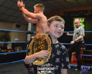 Youngsters have the opportunity to get their photos taken in the ring with the championship belt. Photo: MC Photography and Creations