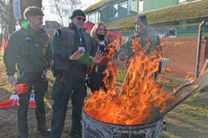 The workers keep warm in the cold temperatures outside the Burton Road hub
