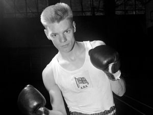 Dick McTaggart with his boxing gloves on at the 1956 Olympics