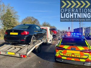 The overloaded vehicles being towed away.