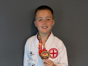 Supporting image for story: Local karate champion on top of the world
