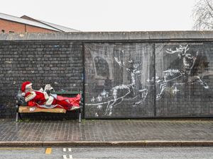 Supporting image for story: Santa spotted at the Banksy artwork in Birmingham