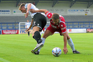 AFC Telfords Mike Phenix, left, tussles and Market Drayton Towns Paul McMullen