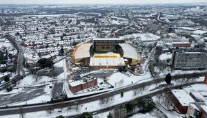 The gold and black of Molineux can be clearly seen amongst the snowy buildings