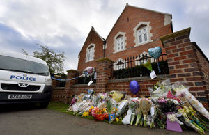 Tributes outside the family home in Greyhound Lane where the attack took place
