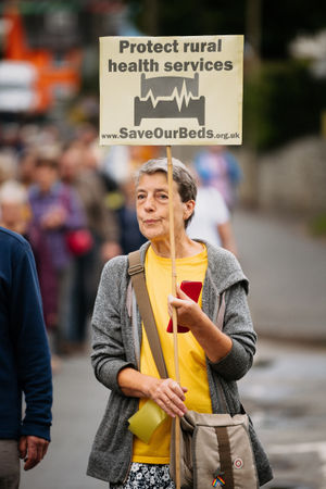 Campaigners have marched in Bishop's Castle calling for health bosses to re-open inpatient beds at their hospital.