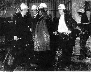 Rev William Lynn speaks with workers